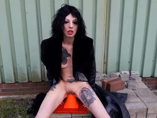 Lucyravenblood outdoor rides on a traffic cone