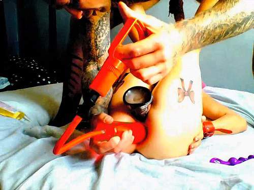 Girl gets dildo penetration during anal pump with insane tattooed male